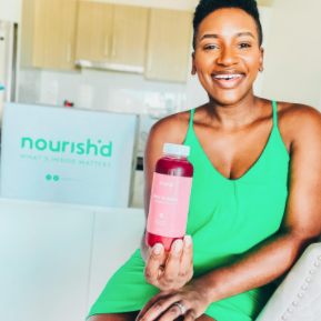 Instagram image of a man sitting at his dining table enjoying a Nourish'd juice, while his meal and cutlery are on the table in front of him.